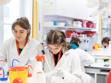 two interns in a laboratory