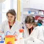 two interns in a laboratory