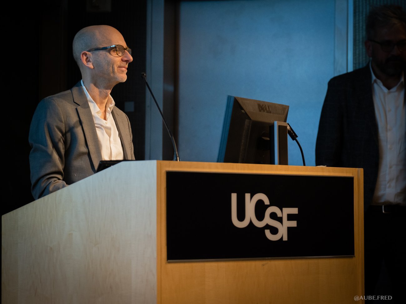  Olivier Schwartz presenting at Symposium in genentech hall UCSF